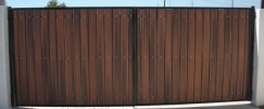 Classic RV gate with black steel and redwood composite
