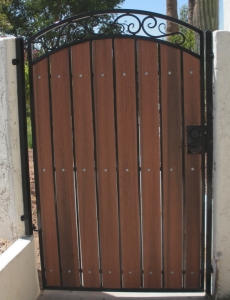 arched pedestrian gate showing redwood composite and black steel