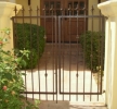 solid steel pickets with spears on this double entry gate
