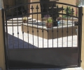 arched courtyard entry gate with kickplate