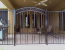 arched decorative gate with standard fencing