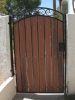 decorative arched gate with privacy panels