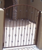 courtyard entry gate with decorative baskets & knuckles