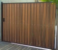 driveway gate with redwood composite privacy slats